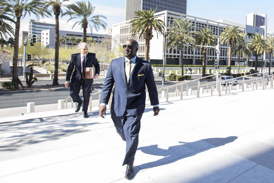 Former Las Vegas City Councilman Ricki Barlow prepares to enter the Lloyd D George Courthouse i ...