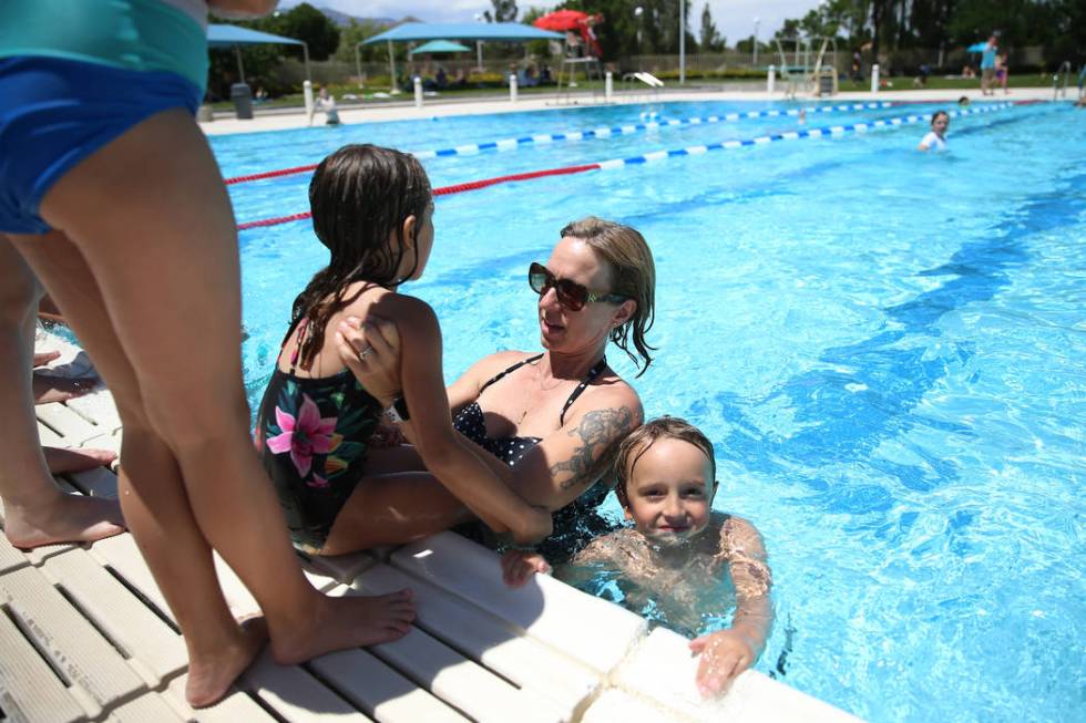 Lisa Knopf, with her children AJ, left, 6, and Adam 4, swim during the annual Ward 4 Summer Spl ...