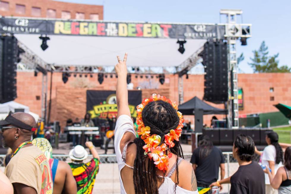 A crowd dances and sings to live reggae music at the Clark County Amphitheatre during Reggae in ...