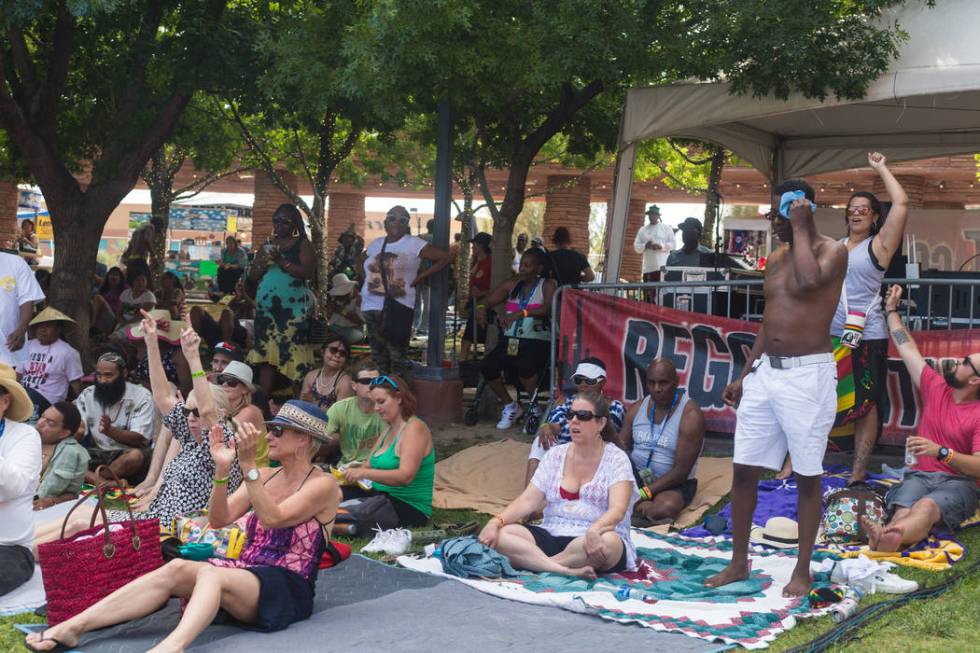 A crowd dances and sings to live reggae music at the Clark County Amphitheatre during Reggae in ...