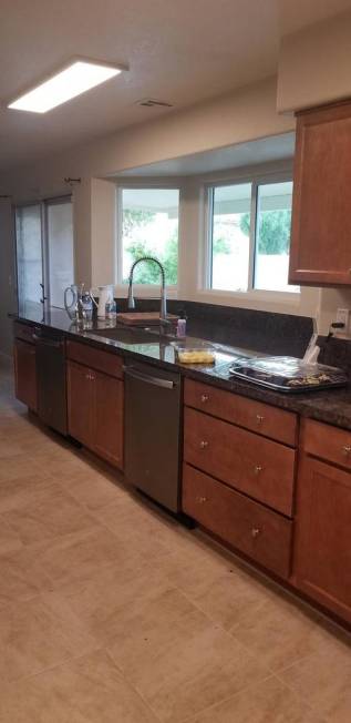 This May, 2019, photo provided by HomeAid of Southern Nevada shows the newly renovated kitchen ...