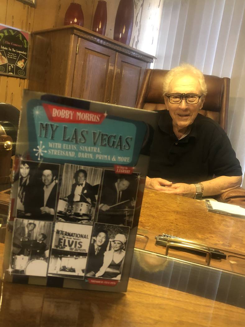 Drumming icon Bobby Morris is shown with his new book, "My Las Vegas," at his office in Las Veg ...