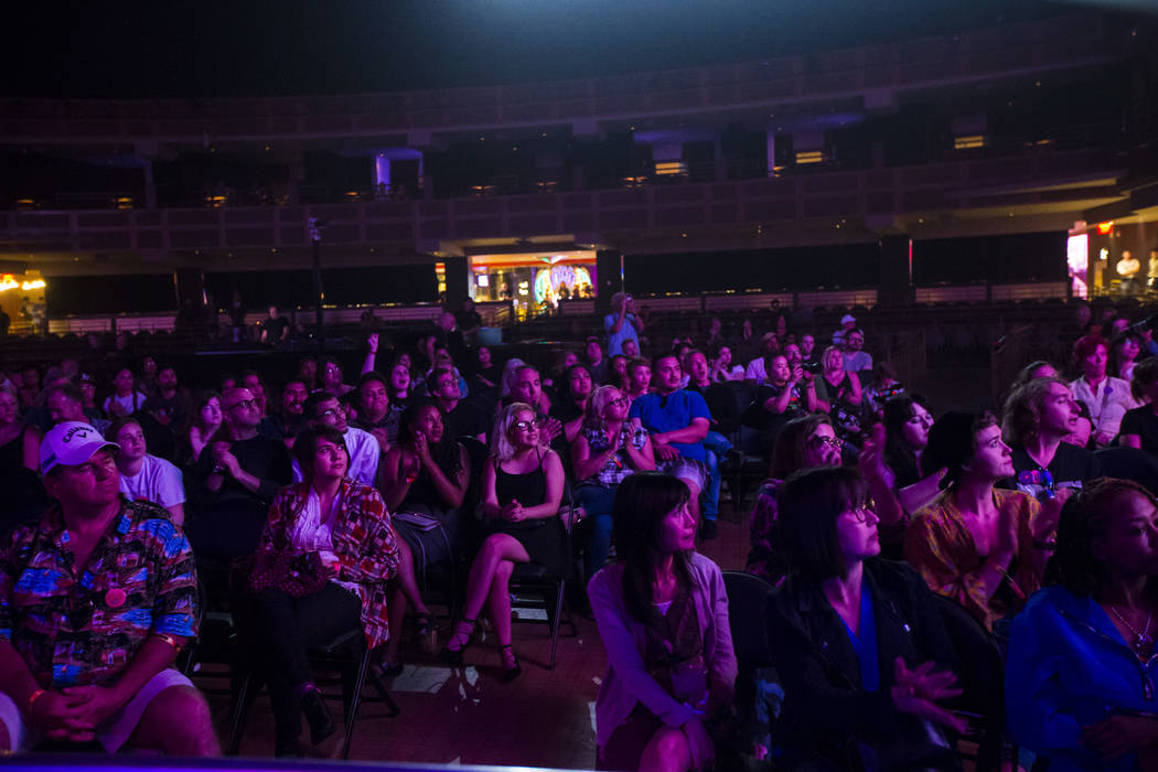 Attendees listen to host John Forte, not pictured, inside The Joint during the first day of the ...