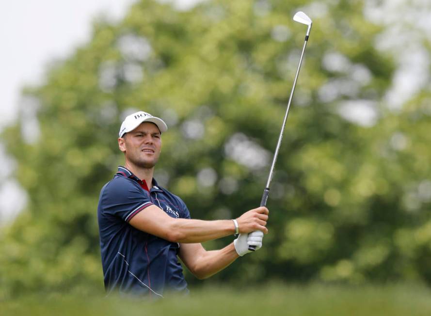 Martin Kaymer, of Germany, watches his tee shot on the third hole during the final round of the ...