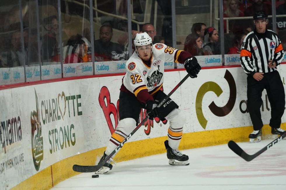 Chicago Wolves defenseman Zach Whitecloud handles the puck in Game 2 of the Calder Cup Final ag ...