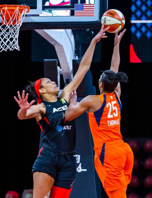 Las Vegas Aces center A'ja Wilson (22) blocks a shot by Connecticut Sun forward Alyssa Thomas ( ...