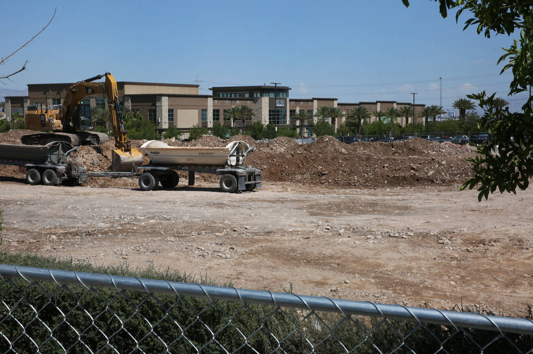 A luxury apartment complex construction site behind Life Time Athletic is seen on Monday, June, ...