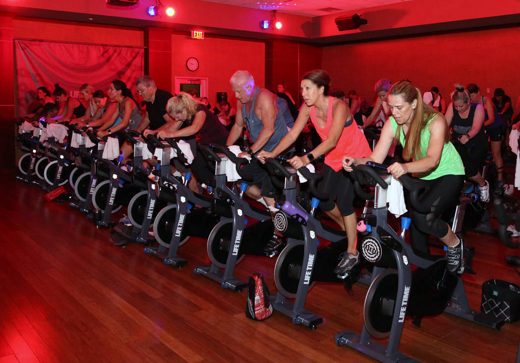 Members at Life Time Athletic exercise during spinning class on Monday, June, 3 2019, in Hender ...