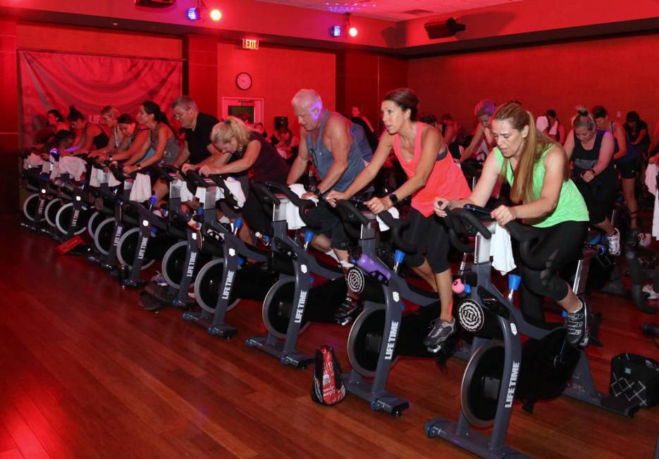 Members at Life Time Athletic exercise during spinning class on Monday, June, 3 2019, in Hender ...