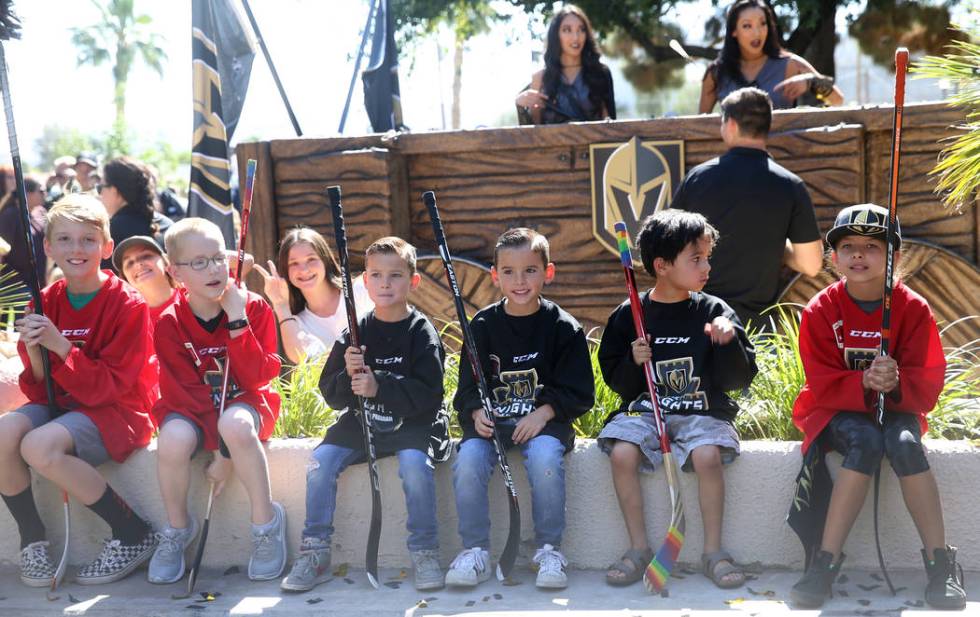 Members of the Lil' Knights introductory hockey program, from left, Ashton C., Ben T., Aryson O ...