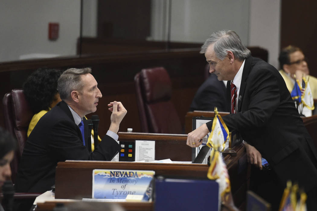 Nevada State Senators Scott Hammond, left, and James Settelmeyer chat during a break on the Sen ...