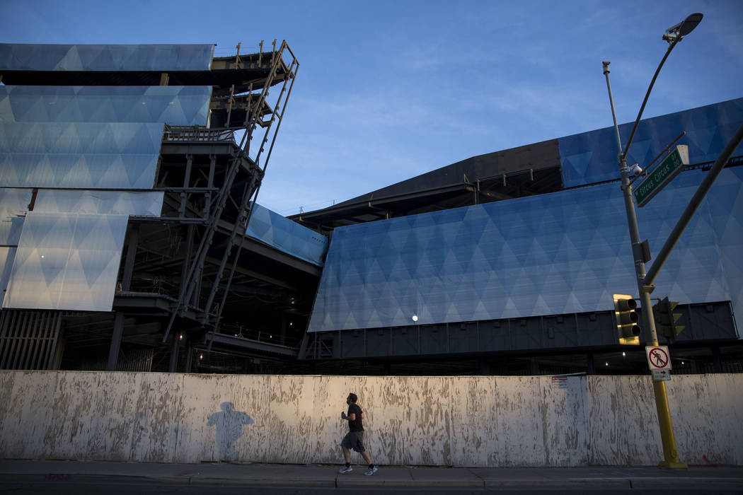 A man runs past the unfinished Fontainebleau resort on the Las Vegas Strip on Wednesday, Dec. 1 ...