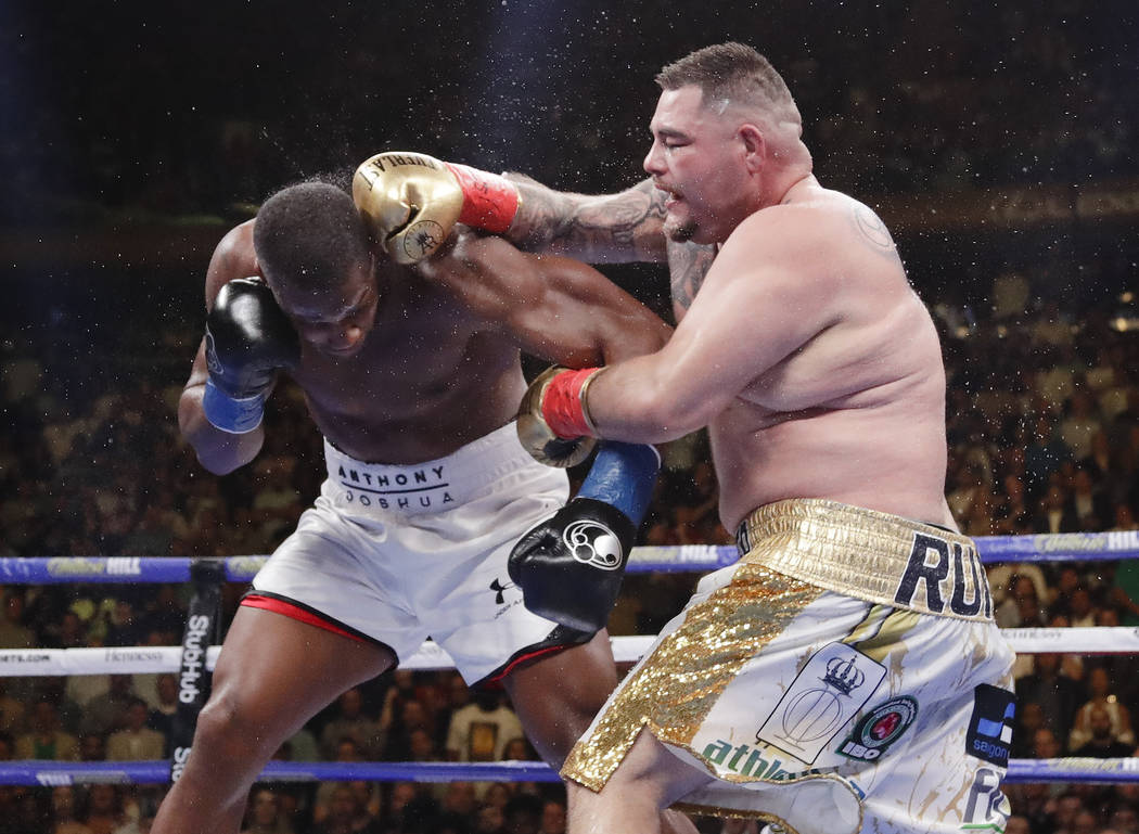 Andy Ruiz, right, punches Anthony Joshua during the seventh round of a heavyweight championship ...