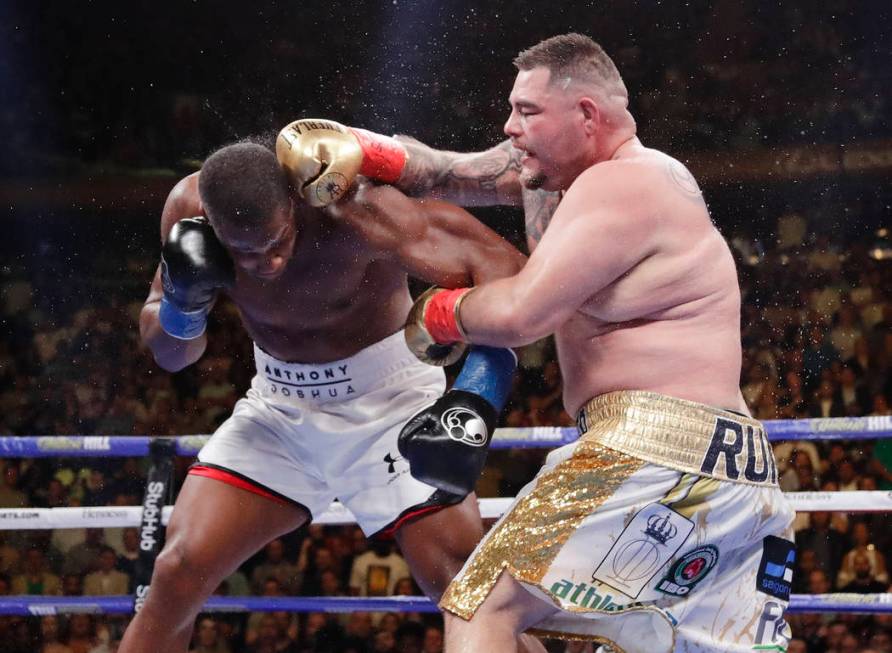 Andy Ruiz, right, punches Anthony Joshua during the seventh round of a heavyweight championship ...