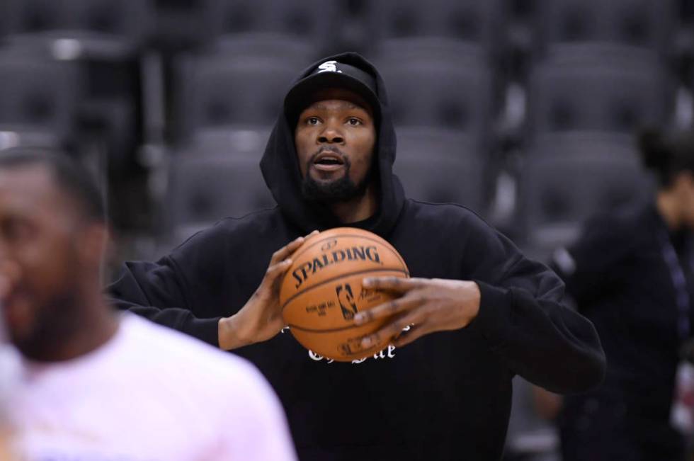 Golden State Warriors Kevin Durant watches during basketball practice at the NBA Finals in Toro ...