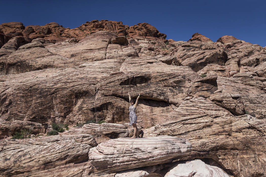 Oksana Watson climbs a boulder during "National Get Outdoors Day" at Red Rock Canyon ...