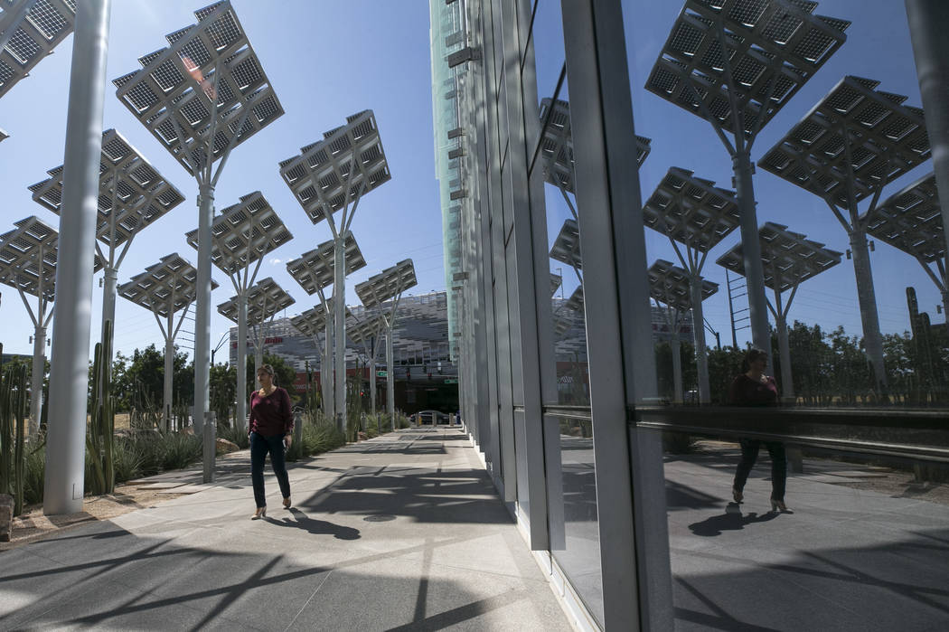 Rows of solar panels soak up the sun's rays outside Las Vegas City Hall in downtown Las Vegas o ...