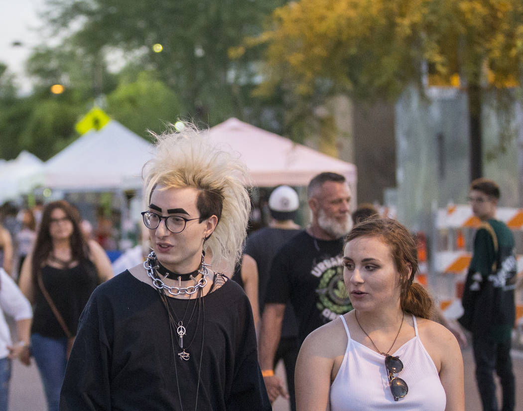 Jack Moran, left, and Logan Ray explore First Friday's "Beat Street" event on Friday, ...