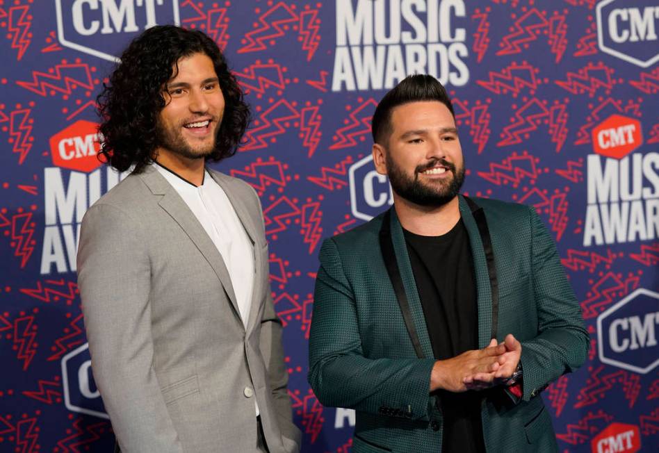 Dan Smyers, left, and Shay Mooney, of Dan + Shay, arrive at the CMT Music Awards on Wednesday, ...