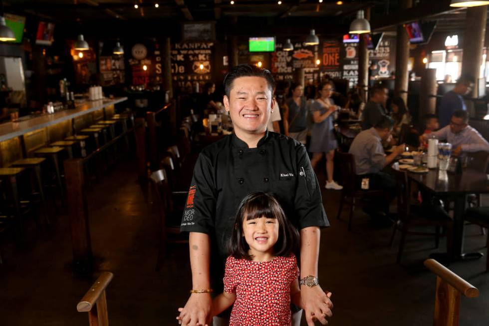 Chef Khai Vu and his daughter, Audrey, 5, at District One Kitchen & Bar in Las Vegas Monday ...