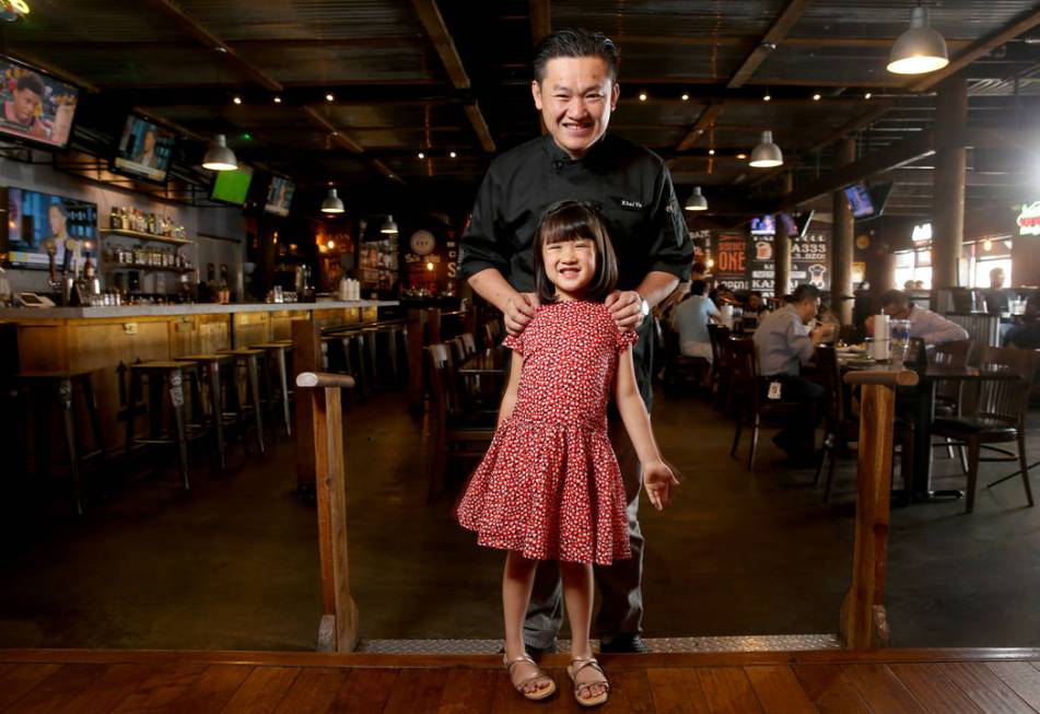 Chef Khai Vu and his daughter, Audrey, 5, at District One Kitchen & Bar in Las Vegas Monday, Ju ...