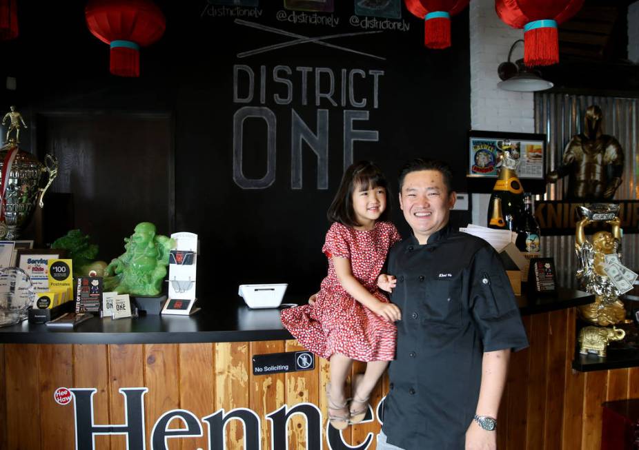 Chef Khai Vu and his daughter, Audrey, 5, at District One Kitchen & Bar in Las Vegas Monday ...