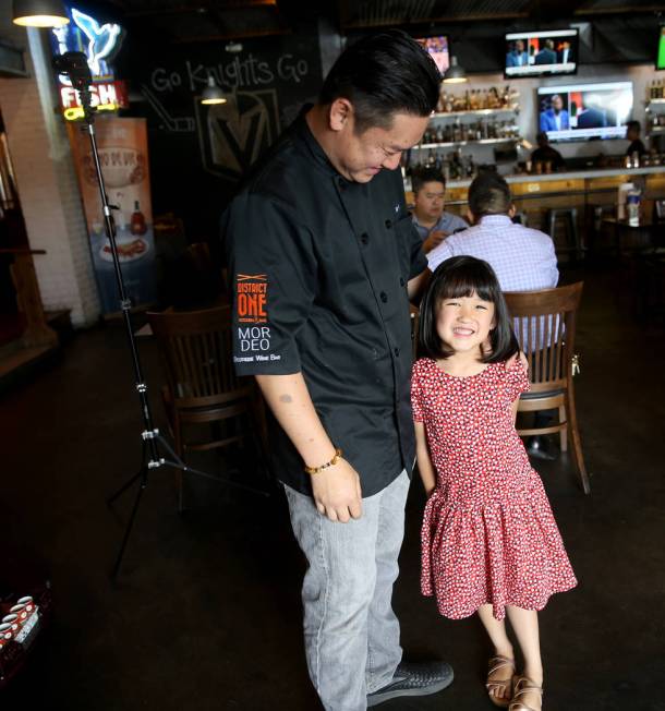 Chef Khai Vu and his daughter, Audrey, 5, at District One Kitchen & Bar in Las Vegas Monday ...