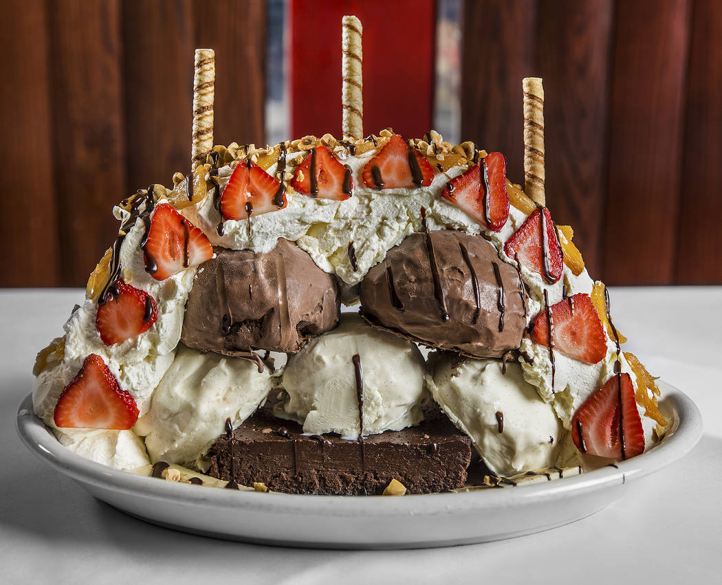 The Titanic sundae with chocolate tart, three scoops of vanilla and chocolate ice cream, strawb ...