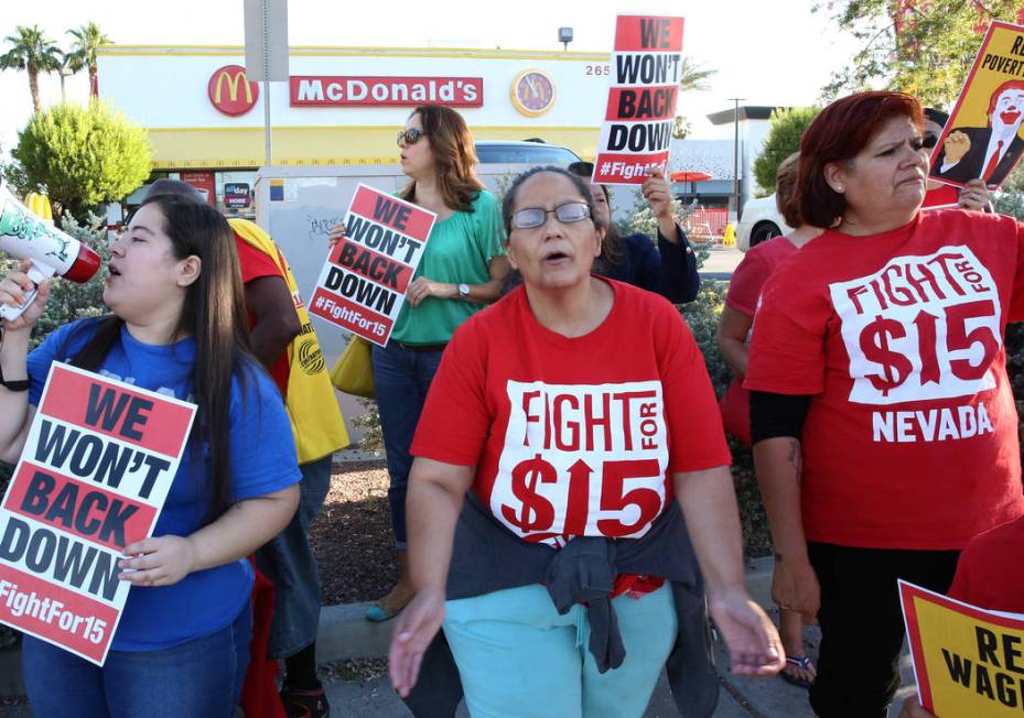 McDonald's franchise employees, including Diana Diaz, center, and Lupe Guzman, right, protest f ...