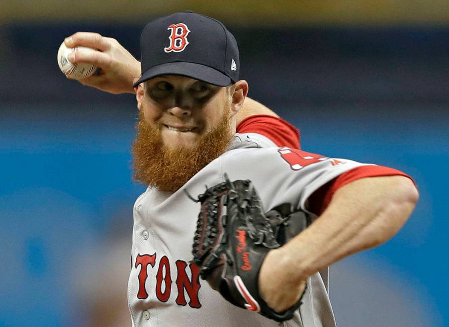 In this March 31, 2018, file photo, Boston Red Sox relief pitcher Craig Kimbrel delivers to the ...