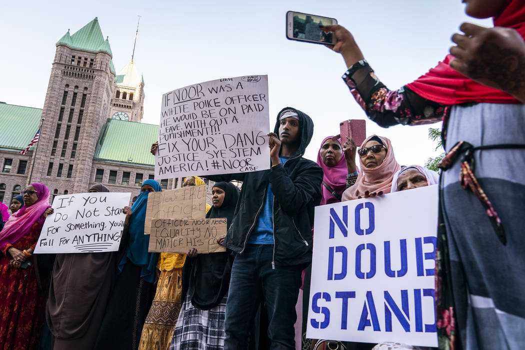 Somali-American supporters rally in support of former Minneapolis police officer Mohamed Noor o ...