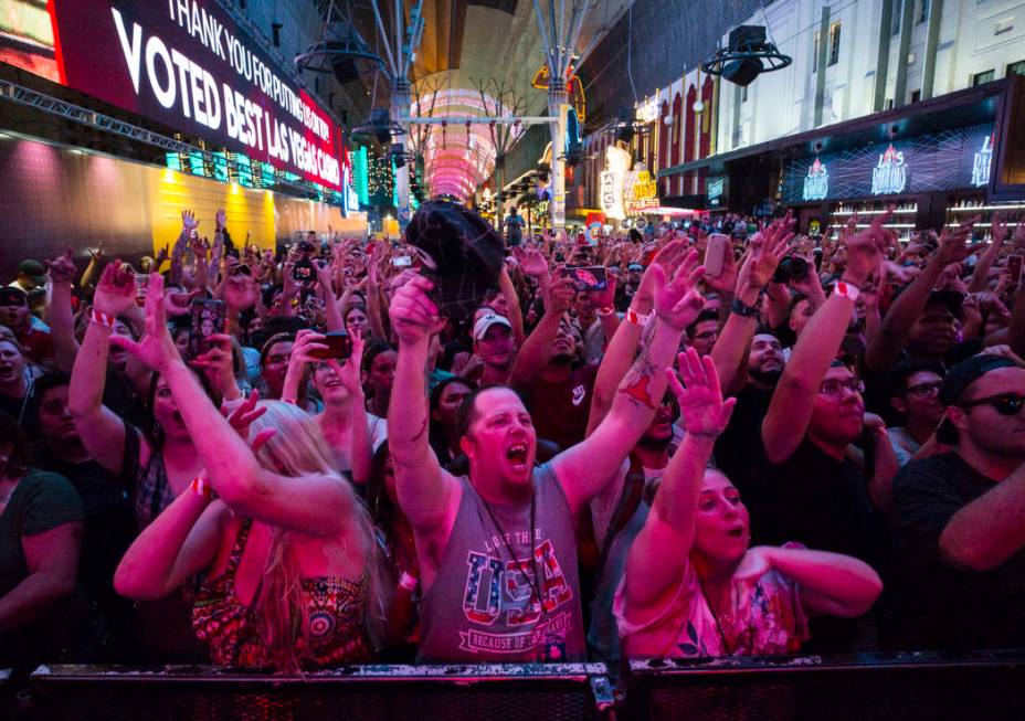 Fans cheer as Steve Aoki performs on the Main Street Stage at the Fremont Street Experience aft ...