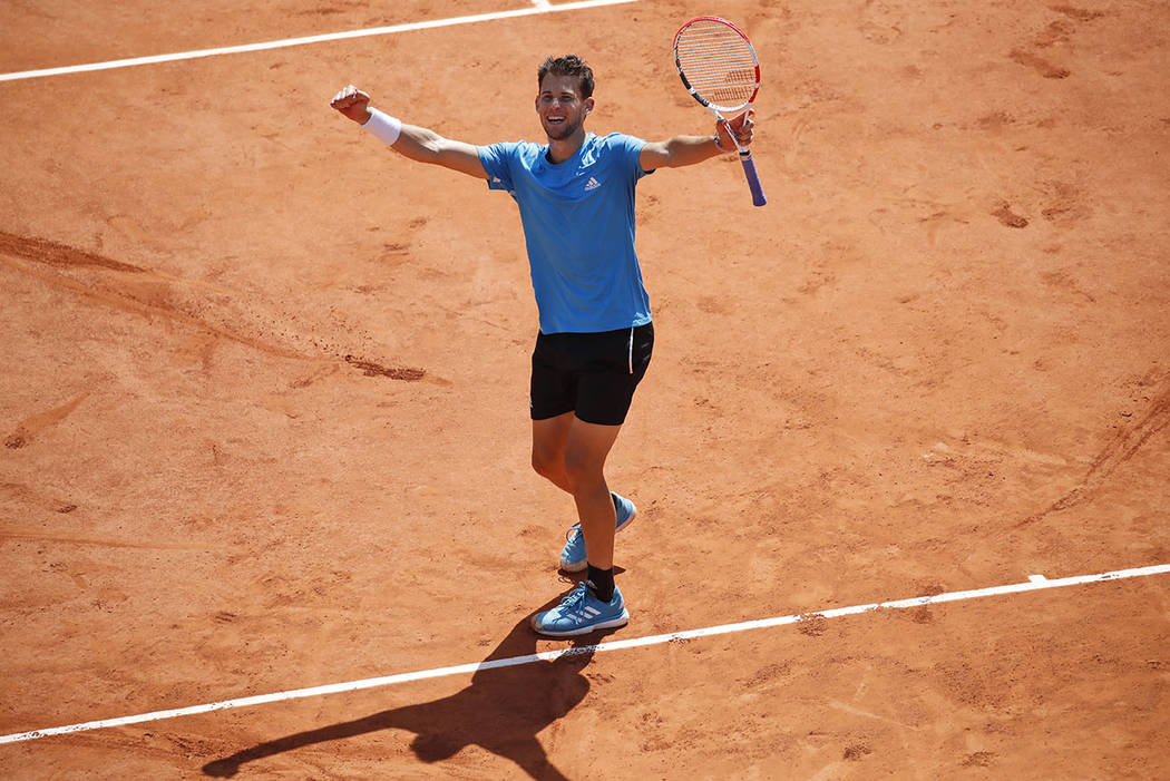 Austria's Dominic Thiem celebrates winning his semifinal match of the French Open tennis tourna ...