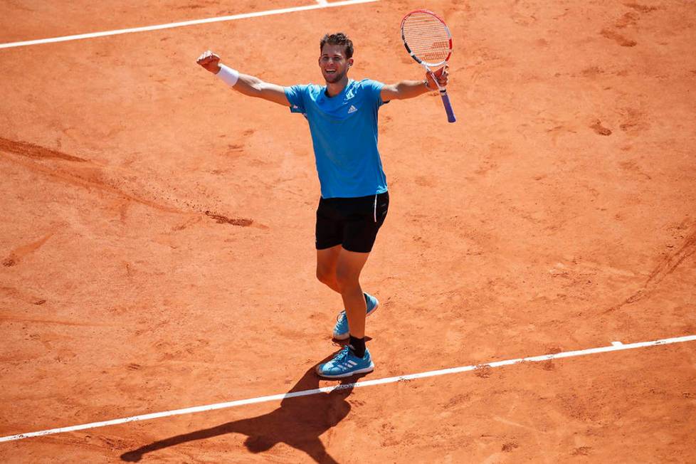 Austria's Dominic Thiem celebrates winning his semifinal match of the French Open tennis tourna ...