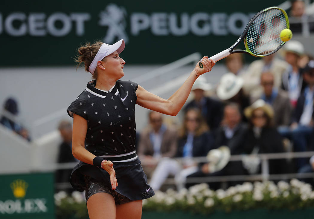 Marketa Vondrousova of the Czech Republic plays a shot against Australia's Ashleigh Barty durin ...