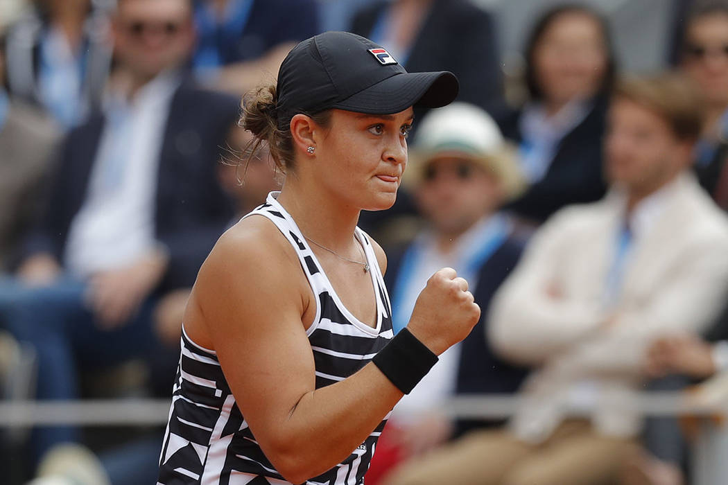 Australia's Ashleigh Barty clenches her fist after scoring a point against Marketa Vondrousova ...