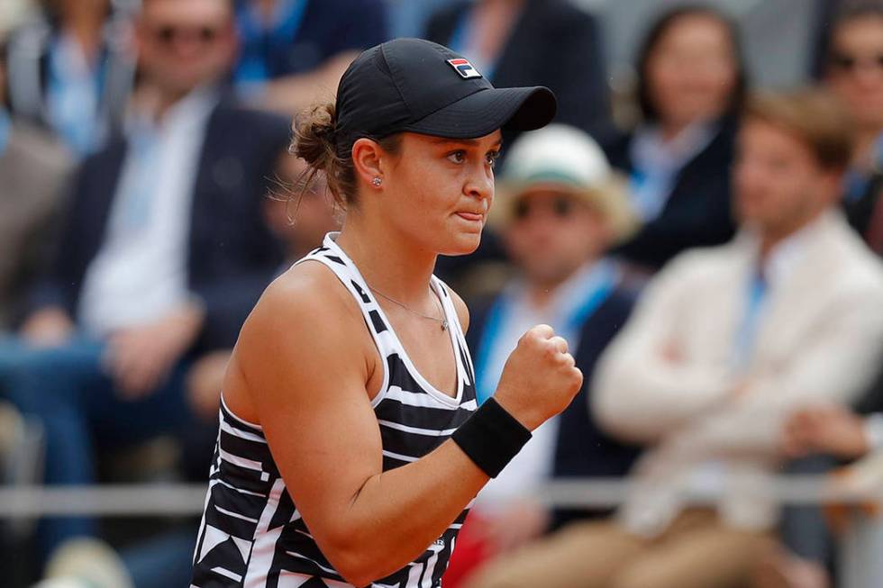 Australia's Ashleigh Barty clenches her fist after scoring a point against Marketa Vondrousova ...