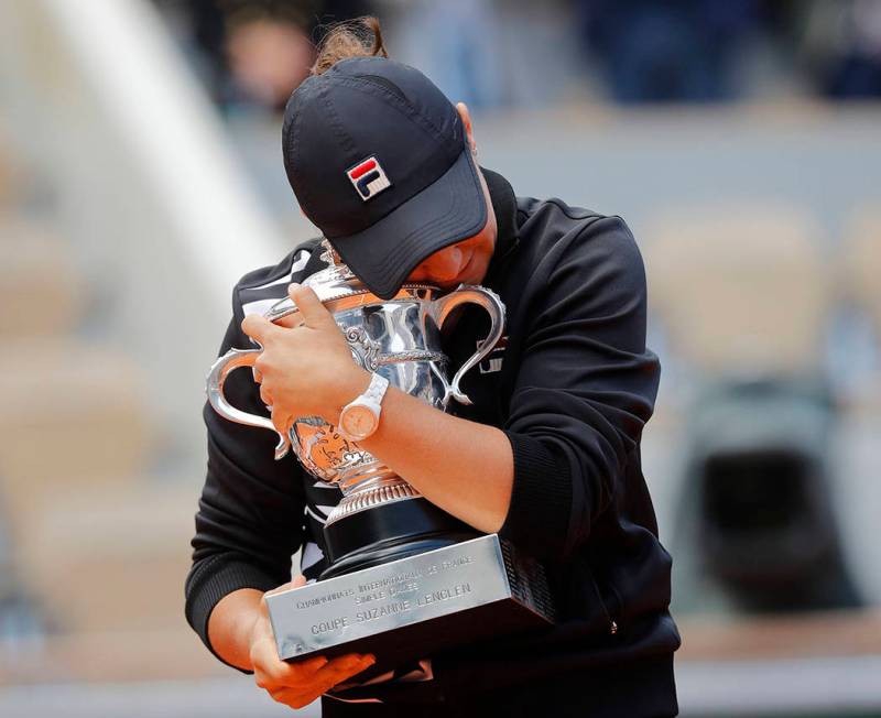 Australia's Ashleigh Barty holds the trophy as she celebrates winning her women's final match o ...