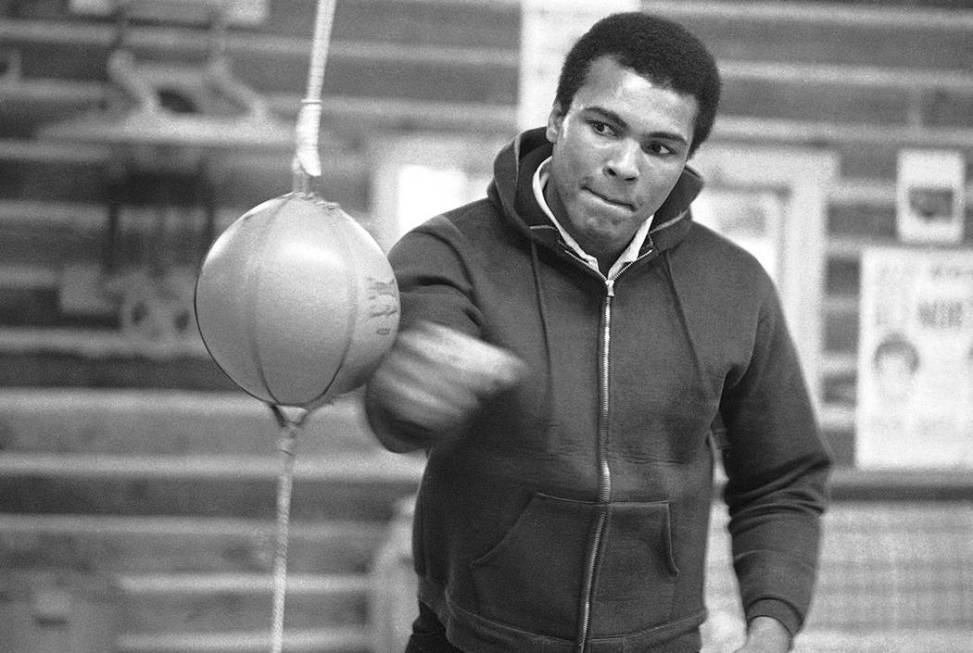 In this Jan. 10, 1974 file photo, Muhammad Ali punches a bag in his Deer Lake, Pa., training ca ...