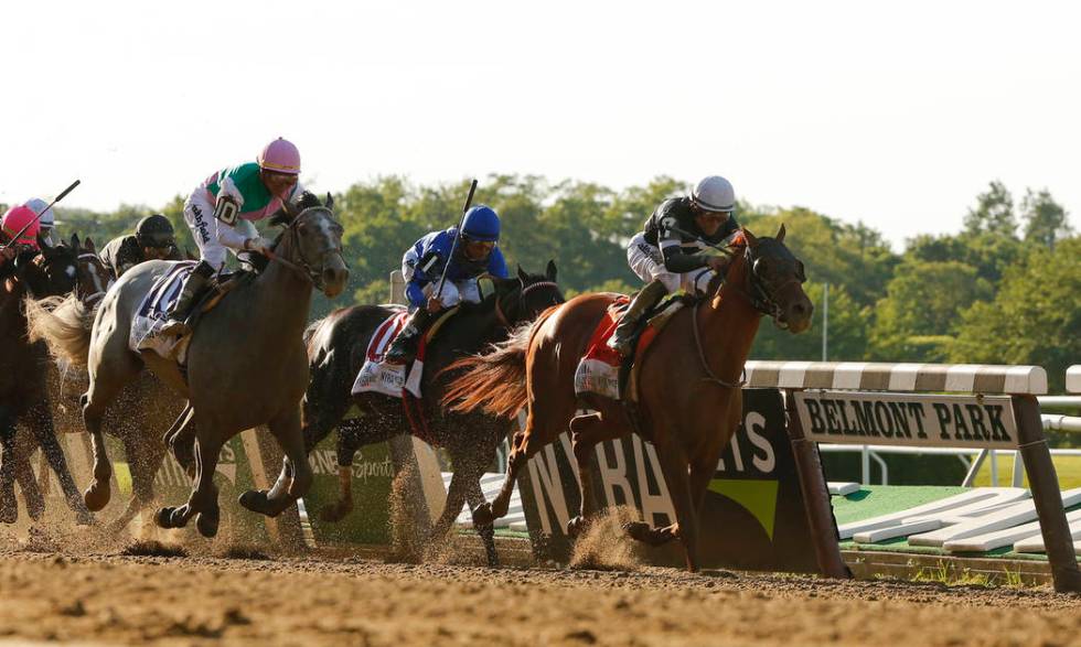 Sir Winston (7), with jockey Joel Rosario up, crosses the finish line to win the 151st running ...