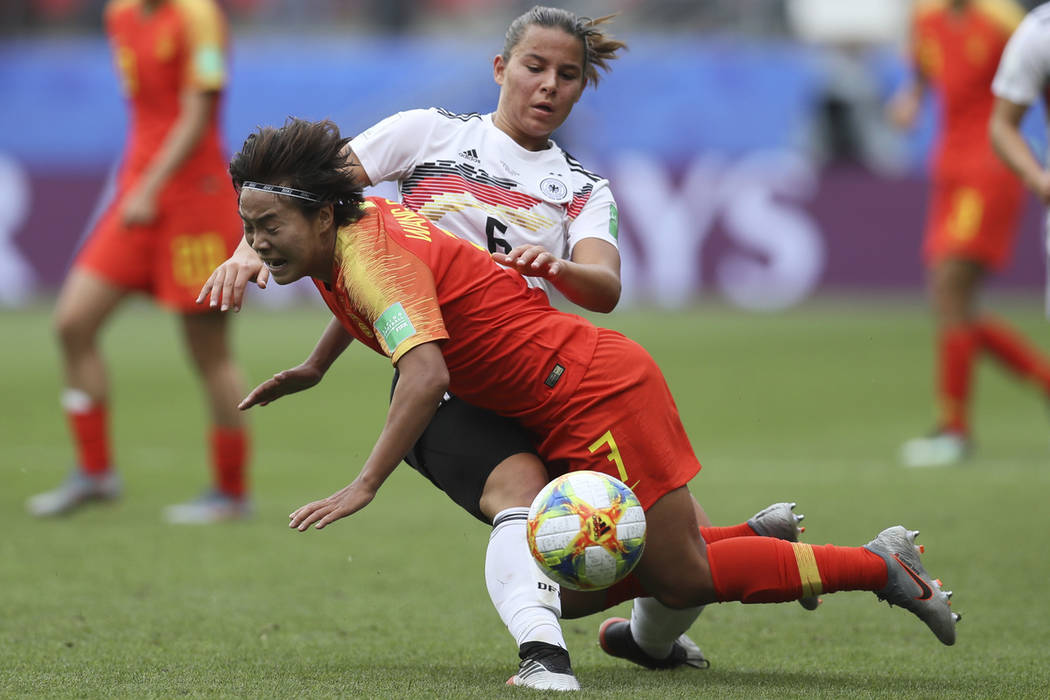 Germany's Lena Oberdorf, background, and China's Wang Shuang vie for the ball during the Women' ...