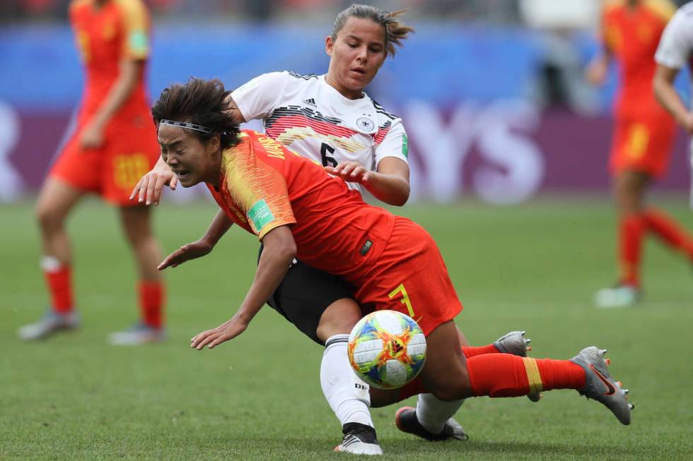 Germany's Lena Oberdorf, background, and China's Wang Shuang vie for the ball during the Women' ...