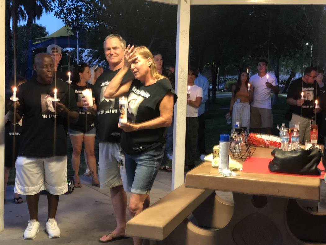 Jamie Minkler, 53, stands next to her husband, 62-year-old Steven Minkler, during a vigil honor ...
