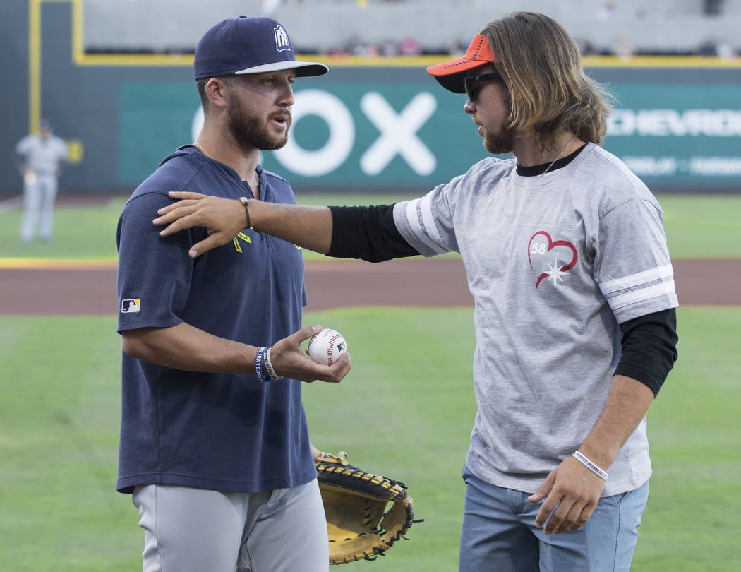 Kaden Manczuk, right, greets San Antonio Missions pitcher Bubba Derby after Manczuk threw out t ...