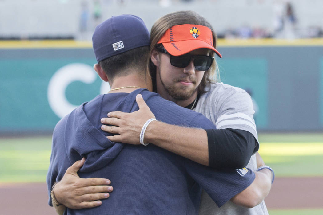 Kaden Manczuk, right, hugs San Antonio Missions pitcher Bubba Derby after Manczuk threw out the ...