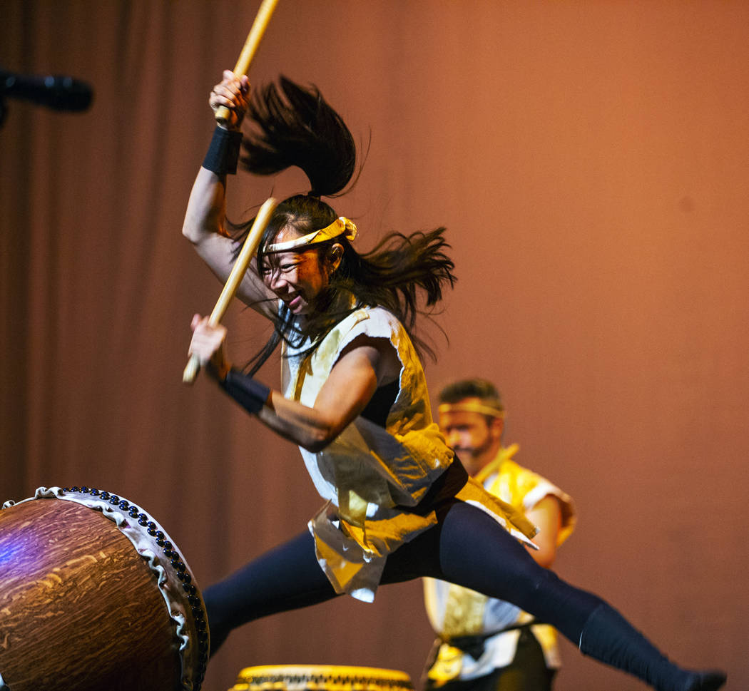 Jen Kong with Korabo jumps while performing the traditional Japanese art form of taiko for a pa ...