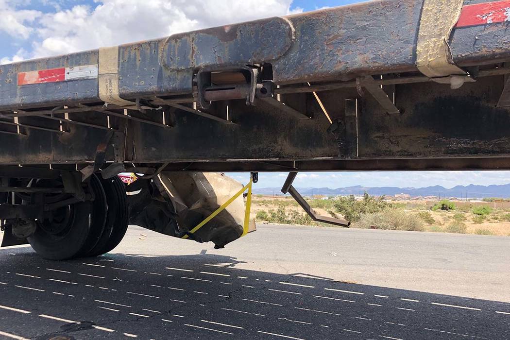 The Nevada Highway Patrol investigates a crash involving a semitrailer hauling double trailers ...