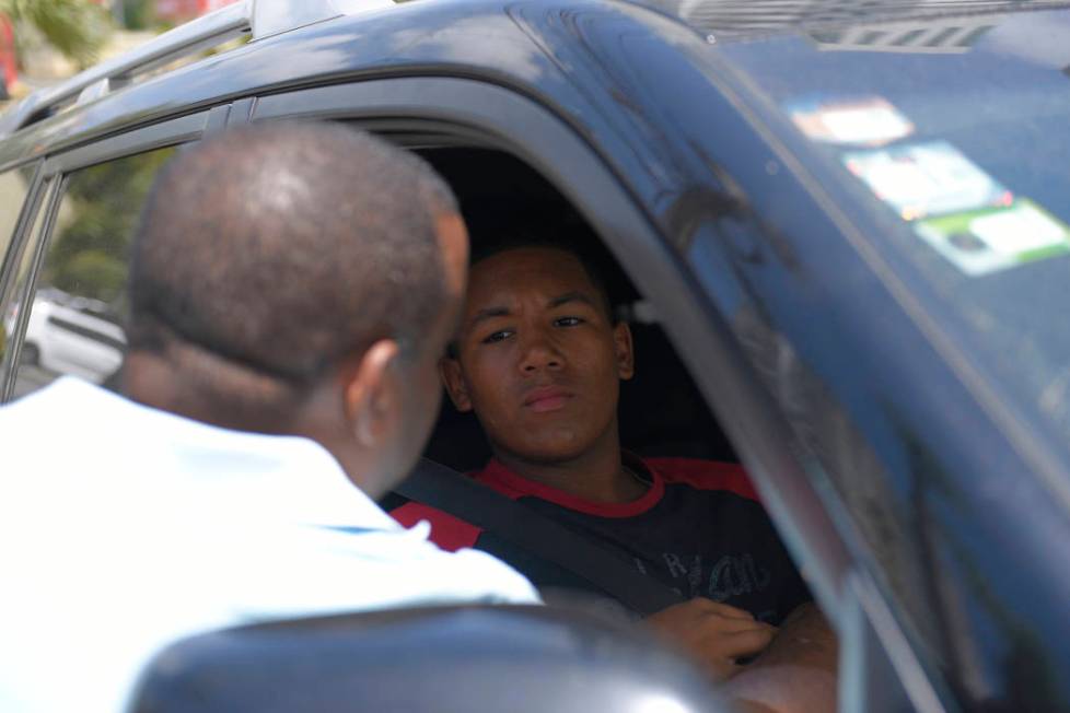 D'Angelo Ortiz, son of former Boston Red Sox slugger David Ortiz, sits in a vehicle outside the ...