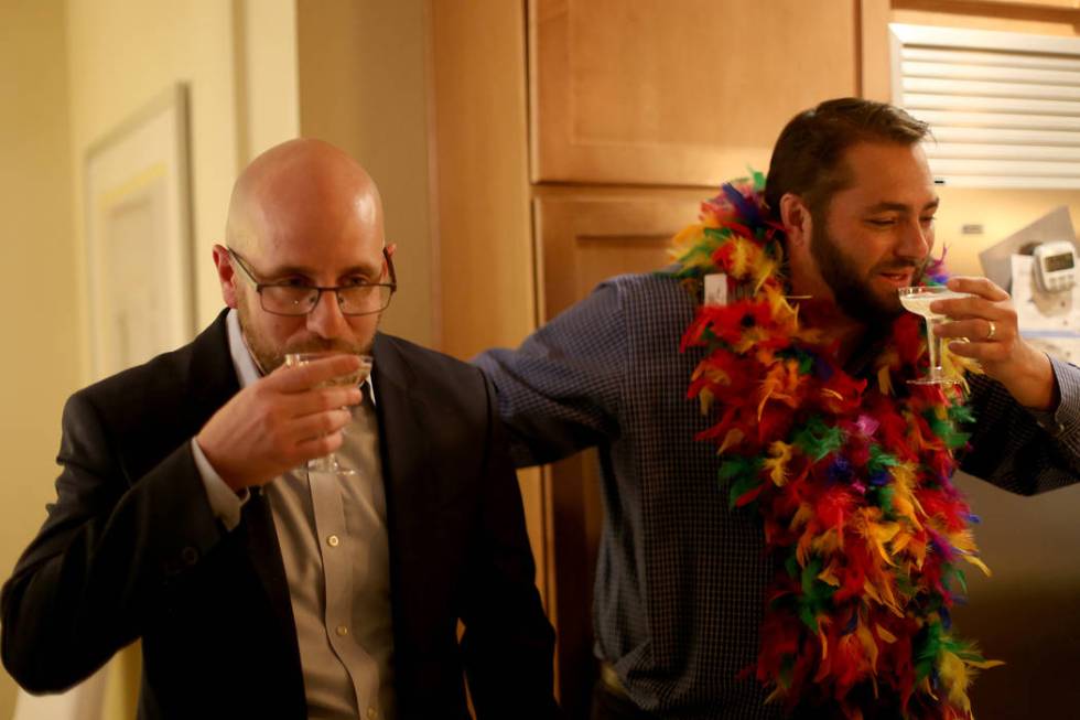 Brian Knudsen, left, winner of the Las Vegas City Council seat for Ward 1, toasts with campaign ...