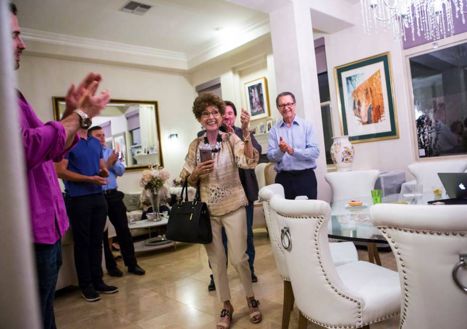 Evelyn Cannestra, center, celebrates as voting results are updated projecting Las Vegas City Co ...